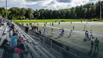 women playing soccer match